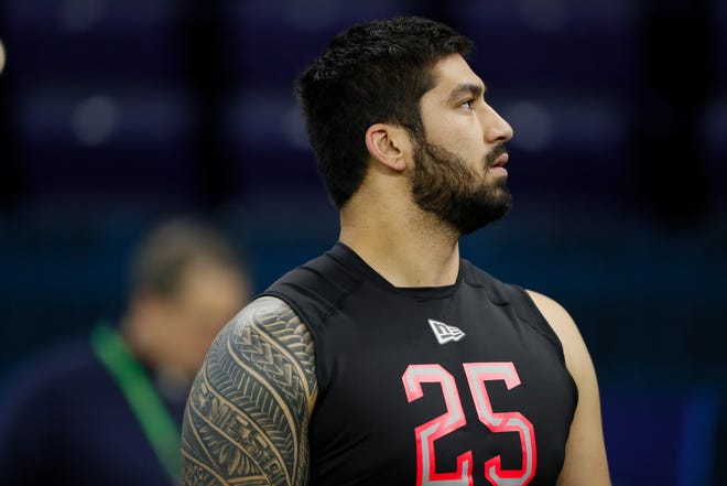 Iowa defensive lineman A.J. Epenesa watches a drill at the NFL football scouting combine in Indianapolis, Saturday, Feb. 29, 2020.