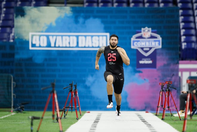 Iowa defensive lineman A.J. Epenesa runs the 40-yard dash at the NFL football scouting combine in Indianapolis, Saturday, Feb. 29, 2020.