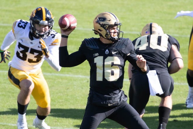 Oct 24, 2020; West Lafayette, Indiana, USA; Purdue Boilermakers quarterback Aidan O'Connell (16) throws the ball in the first quarter against the Iowa Hawkeyes at Ross-Ade Stadium. Mandatory Credit: Trevor Ruszkowski-USA TODAY Sports