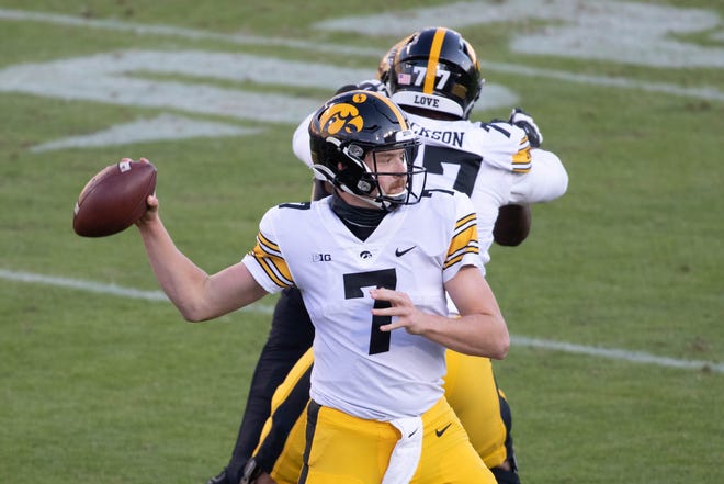 Oct 24, 2020; West Lafayette, Indiana, USA; Iowa Hawkeyes quarterback Spencer Petras (7) passes the ball in the second quarter against the Purdue Boilermakers at Ross-Ade Stadium. Mandatory Credit: Trevor Ruszkowski-USA TODAY Sports