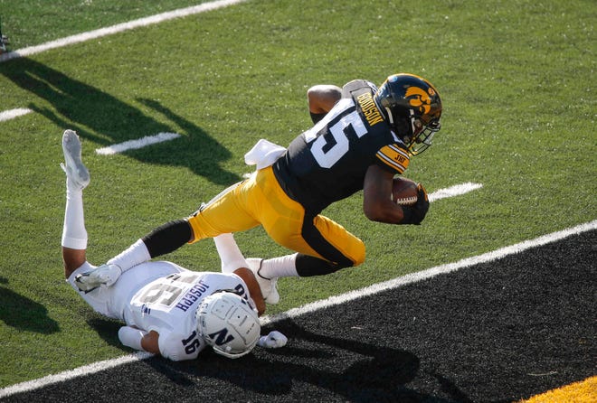 Iowa sophomore running back Tyler Goodson rumbles into the end zone in the first quarter against Northwestern at Kinnick Stadium in Iowa City on Saturday, Oct. 31, 2020.