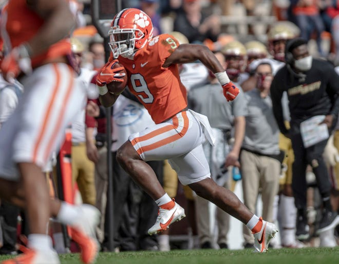 Picking up the slack with star QB Trevor Lawrence out, Clemson running back Travis Etienne had 84 yards and a touchdown on 20 carries - breaking the ACC rushing record in the process - and also had seven catches for 140 yards and another score in the Tigers ' win over Boston College.