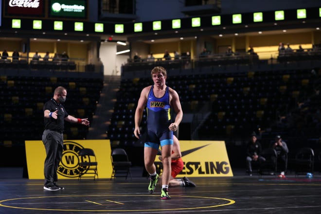 Iowa's Jacob Warner walks back to the center mat during the Hawkeye Wrestling Club Showdown Open on Sunday, Nov. 1, 2020, in Xtream Arena & GreenState Family Fieldhouse in Coralville, Iowa.