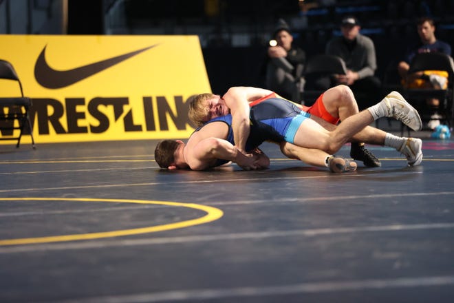 Iowa's Nelson Brands, red, works a gut wrench against Abe Assad during the Hawkeye Wrestling Club Showdown Open on Sunday, Nov. 1, 2020, in Xtream Arena & GreenState Family Fieldhouse in Coralville, Iowa.