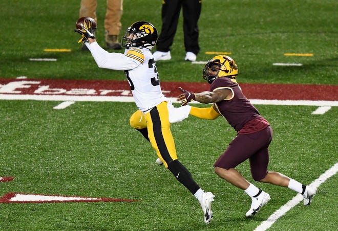 MINNEAPOLIS, MINNESOTA - NOVEMBER 13: Riley Moss #33 of the Iowa Hawkeyes intercepts a pass intended for Chris Autman-Bell #7 of the Minnesota Golden Gophers during the fourth quarter of the game at TCF Bank Stadium on November 13, 2020 in Minneapolis, Minnesota. Iowa defeated Minnesota 35-7. (Photo by Hannah Foslien/Getty Images)