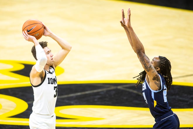 Iowa guard Jordan Bohannon (3) looks to pass as Southern University's Lamarcus Lee, right, defends during a NCAA non-conference men's basketball game, Friday, Nov. 27, 2020, at Carver-Hawkeye Arena in Iowa City, Iowa.