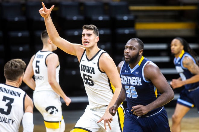 Iowa center Luka Garza (55) reacts after making a basket during a NCAA non-conference men's basketball game against Southern University, Friday, Nov. 27, 2020, at Carver-Hawkeye Arena in Iowa City, Iowa.