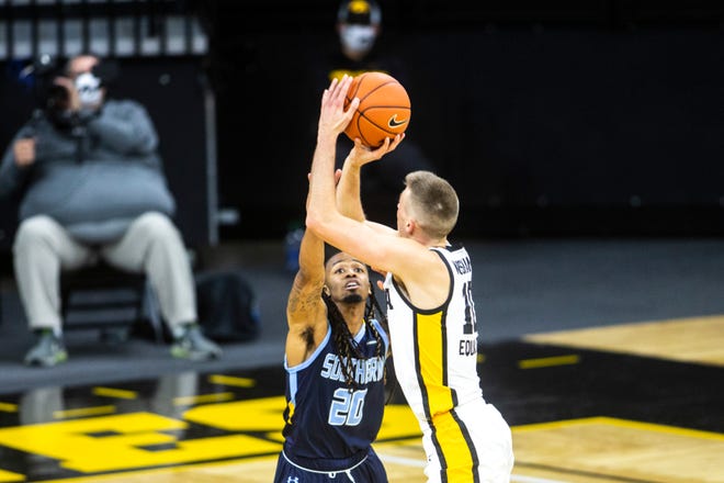 Iowa's Joe Wieskamp (10) makes a 3-point basket as Southern University's Lamarcus Lee (20) defends during a NCAA non-conference men's basketball game, Friday, Nov. 27, 2020, at Carver-Hawkeye Arena in Iowa City, Iowa.