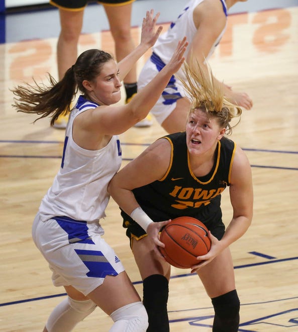 Iowa center Monika Czinano takes the ball under the hoop in the first quarter against Drake at the Knapp Center in Des Moines on Wednesday, Dec. 2, 2020.