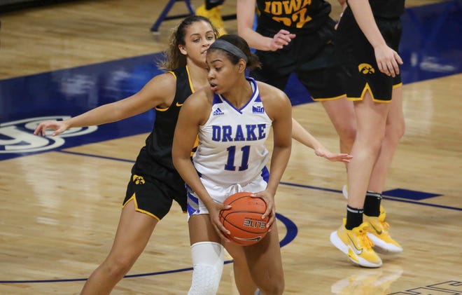 Drake's Kierra Collier looks for an opening around Iowa's Gabbie Marshall in the first quarter at the Knapp Center in Des Moines on Wednesday, Dec. 2, 2020.