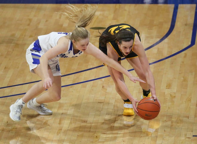 Iowa guard Caitlin Clark scoops up a loose ball in the second quarter against Drake at the Knapp Center in Des Moines on Wednesday, Dec. 2, 2020.at the Knapp Center in Des Moines on Wednesday, Dec. 2, 2020.