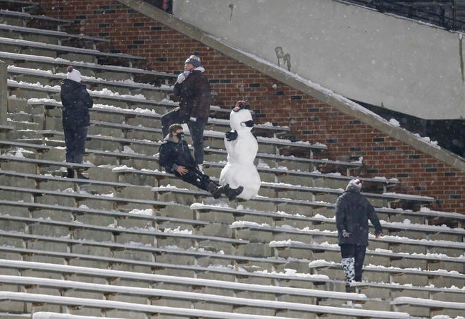 Iowa fans build a snowman in the stands as Iowa plays Wisconsin on Saturday, Dec. 12, 2020, at Kinnick Stadium in Iowa City, Iowa.