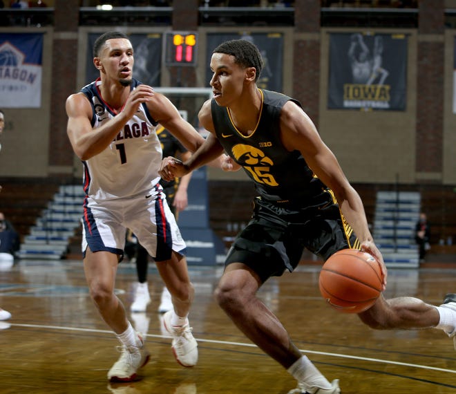 SIOUX FALLS, SD - DECEMBER 19: Keegan Murray #15 of the Iowa Hawkeyes drives to the basket against Jalen Suggs #1 of the Gonzaga Bulldogs during their game at the Sanford Pentagon on December 17, 2020 in Sioux Falls, South Dakota. (Photo by Dave Eggen/Inertia)