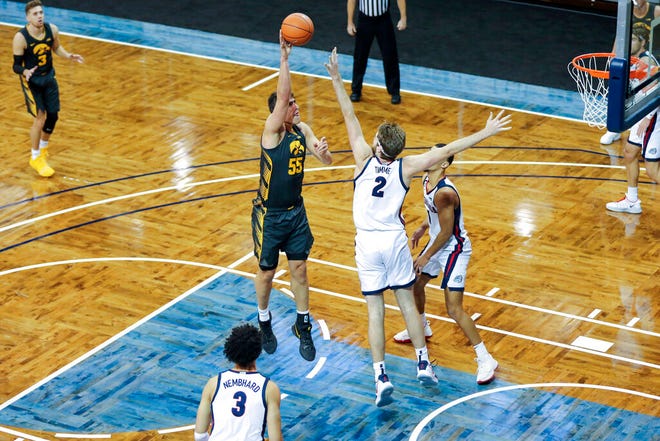 Iowa center Luka Garza (55) shoots a hook shot over Gonzaga defender Drew Timme (2) during the first half of an NCAA college basketball game Saturday, Dec. 19, 2020, in SIoux Falls, S.D. (AP Photo/Josh Jurgens)