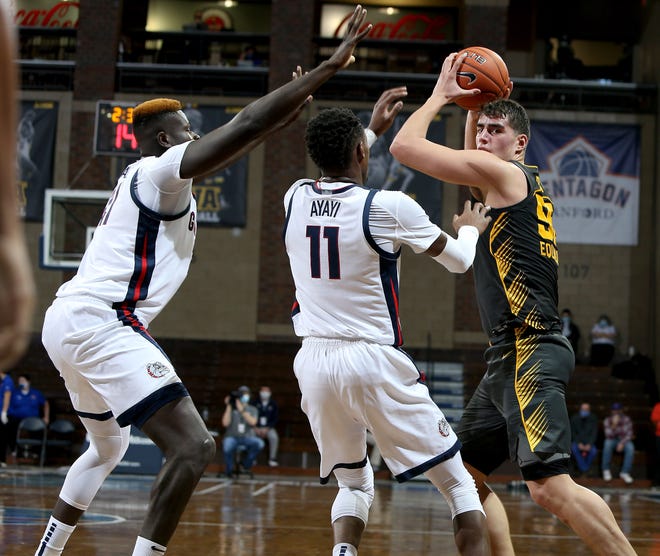 SIOUX FALLS, SD - DECEMBER 19: Luka Garza #55 of the Iowa Hawkeyes looks for help out of a double team by Oumar Ballo #21 and Joel Ayayi #11 of the Gonzaga Bulldogs during their game at the Sanford Pentagon on December 17, 2020 in Sioux Falls, South Dakota. (Photo by Dave Eggen/Inertia)