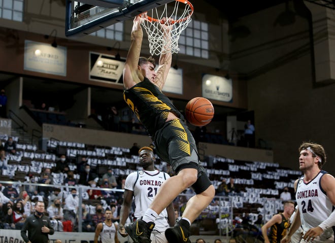 SIOUX FALLS, SD - DECEMBER 19: Luka Garza #55 of the Iowa Hawkeyes slams home two points against Gonzaga Bulldogs during their game at the Sanford Pentagon on December 17, 2020 in Sioux Falls, South Dakota. (Photo by Dave Eggen/Inertia)