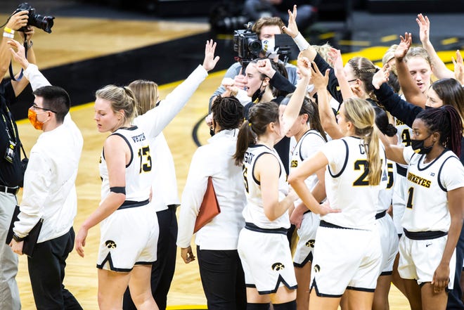 Iowa Hawkeyes players wave to their families after a NCAA non-conference women's basketball game against Western Illinois, Tuesday, Dec. 22, 2020, at Carver-Hawkeye Arena in Iowa City, Iowa.
