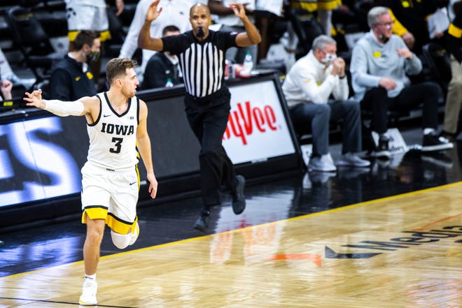 Iowa guard Jordan Bohannon (3) reacts after making a 3-point basket during a NCAA Big Ten Conference men's basketball game, Tuesday, Dec. 22, 2020, at Carver-Hawkeye Arena in Iowa City, Iowa.