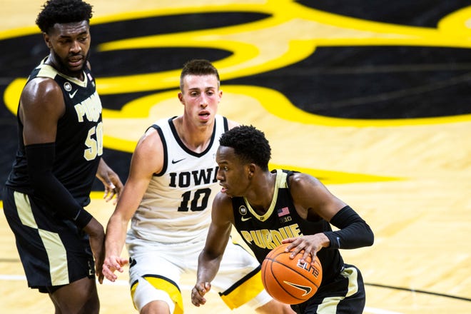 Purdue guard Eric Hunter Jr. drives to the basket as Iowa's Joe Wieskamp (10) defends during a NCAA Big Ten Conference men's basketball game, Tuesday, Dec. 22, 2020, at Carver-Hawkeye Arena in Iowa City, Iowa.
