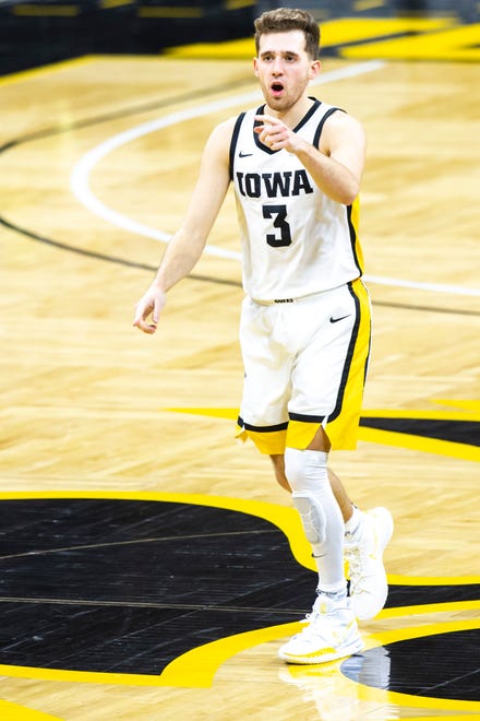 Iowa guard Jordan Bohannon (3) reacts after making a 3-point basket during a NCAA Big Ten Conference men's basketball game against Northwestern, Tuesday, Dec. 29, 2020, at Carver-Hawkeye Arena in Iowa City, Iowa.