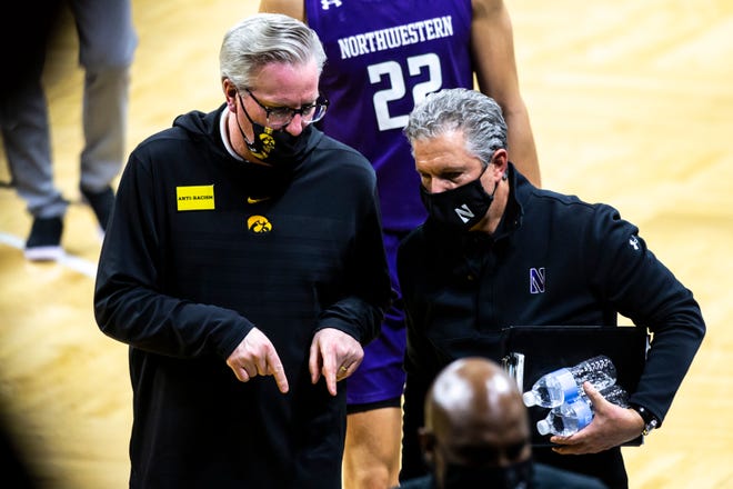 Iowa head coach Fran McCaffery, left, talks with Northwestern assistant coach Brian James after a NCAA Big Ten Conference men's basketball game, Tuesday, Dec. 29, 2020, at Carver-Hawkeye Arena in Iowa City, Iowa.