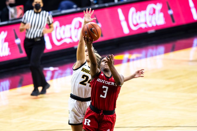 Rutgers guard Diamond Johnson (3) makes a basket as Iowa guard Gabbie Marshall, left, defends during a NCAA Big Ten Conference women's basketball game, Thursday, Dec. 31, 2020, at Carver-Hawkeye Arena in Iowa City, Iowa.