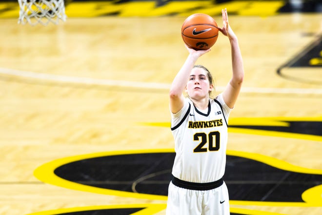 Iowa guard Kate Martin (20) shoots a free throw during a NCAA Big Ten Conference women's basketball game, Thursday, Dec. 31, 2020, at Carver-Hawkeye Arena in Iowa City, Iowa.