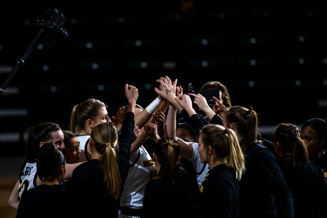 Iowa Hawkeyes players, including, Iowa guard Caitlin Clark, left, and Iowa center Monika Czinano huddle up before a NCAA Big Ten Conference women's basketball game, Thursday, Dec. 31, 2020, at Carver-Hawkeye Arena in Iowa City, Iowa.