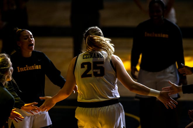 Iowa center Monika Czinano (25) is introduced before a NCAA Big Ten Conference women's basketball game against Rutgers, Thursday, Dec. 31, 2020, at Carver-Hawkeye Arena in Iowa City, Iowa.
