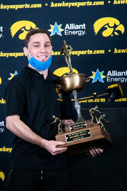 Iowa 125-pound wrestler Spencer Lee is presented with the 2020 Dan Hodge Trophy during Hawkeyes wrestling media day, Tuesday, Jan. 5, 2021, at the McCord Club level of Kinnick Stadium in Iowa City, Iowa.