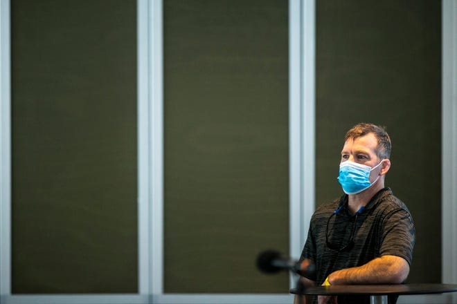 Iowa head coach Tom Brands wears a face mask before speaking to reporters during Hawkeyes wrestling media day, Tuesday, Jan. 5, 2021, at the McCord Club level of Kinnick Stadium in Iowa City, Iowa.