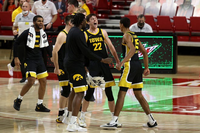 COLLEGE PARK, MARYLAND - JANUARY 07: Keegan Murray #15 celebrates with Patrick McCaffery #22 of the Iowa Hawkeyes in the first half against the Maryland Terrapins at Xfinity Center on January 07, 2021 in College Park, Maryland.
