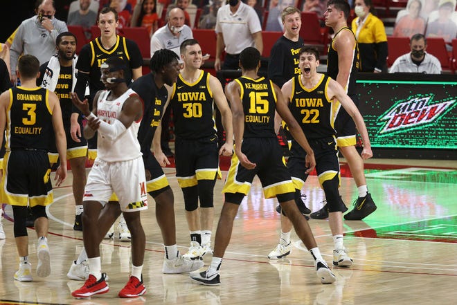 COLLEGE PARK, MARYLAND - JANUARY 07: Keegan Murray #15 celebrates with Patrick McCaffery #22 of the Iowa Hawkeyes in the first half against the Maryland Terrapins at Xfinity Center on January 07, 2021 in College Park, Maryland.