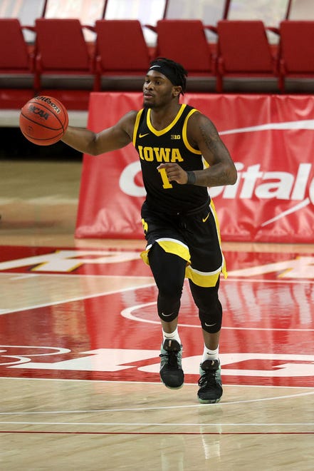 COLLEGE PARK, MARYLAND - JANUARY 07: Joe Toussaint #1 of the Iowa Hawkeyes dribbles the ball against the Maryland Terrapins at Xfinity Center on January 07, 2021 in College Park, Maryland.