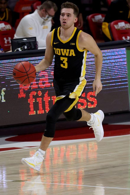 COLLEGE PARK, MARYLAND - JANUARY 07: Jordan Bohannon #3 of the Iowa Hawkeyes dribbles the ball in the second half against the Maryland Terrapins at Xfinity Center on January 07, 2021 in College Park, Maryland.