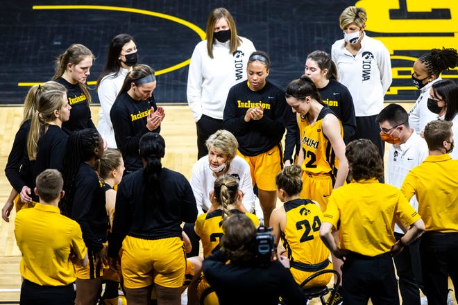 Iowa head coach Lisa Bluder talks with players during a NCAA Big Ten Conference women's basketball game, Wednesday, Jan. 13, 2021, at Carver-Hawkeye Arena in Iowa City, Iowa.