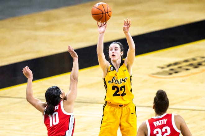 Iowa guard Caitlin Clark (22) makes a basket as Ohio State guard Braxtin Miller (10) defends during a NCAA Big Ten Conference women's basketball game, Wednesday, Jan. 13, 2021, at Carver-Hawkeye Arena in Iowa City, Iowa.