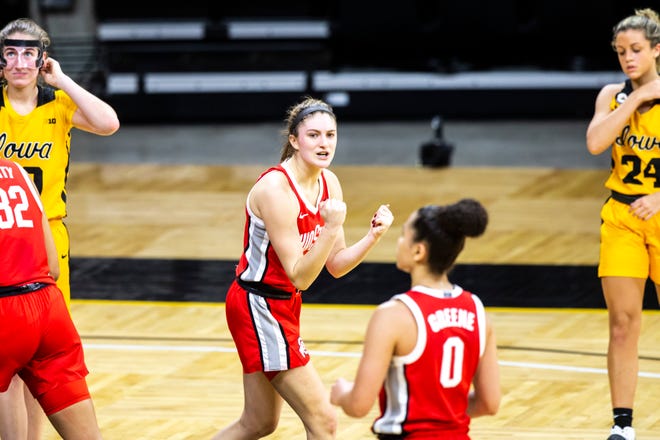 Ohio State guard Jacy Sheldon, center, reacts after the Buckeyes defeated the Hawkeyes in overtime during a NCAA Big Ten Conference women's basketball game, Wednesday, Jan. 13, 2021, at Carver-Hawkeye Arena in Iowa City, Iowa.