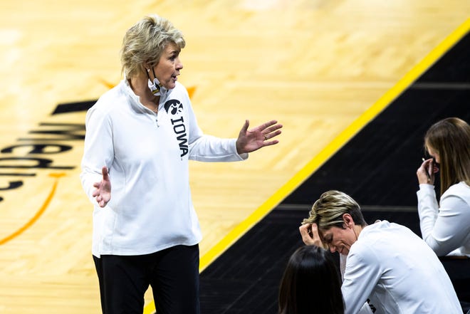 Iowa head coach Lisa Bluder tuns to the bench as Iowa associate head coach Jan Jensen reacts during a NCAA Big Ten Conference women's basketball game against Ohio State, Wednesday, Jan. 13, 2021, at Carver-Hawkeye Arena in Iowa City, Iowa.