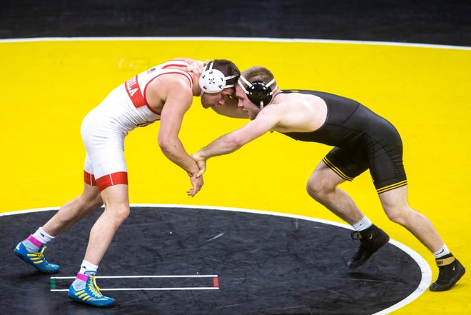 Nebraska's Mikey Labriola, left, wrestles Iowa's Patrick Kennedy at 174 pounds during a NCAA Big Ten Conference wrestling dual, Friday, Jan. 15, 2021, at Carver-Hawkeye Arena in Iowa City, Iowa.