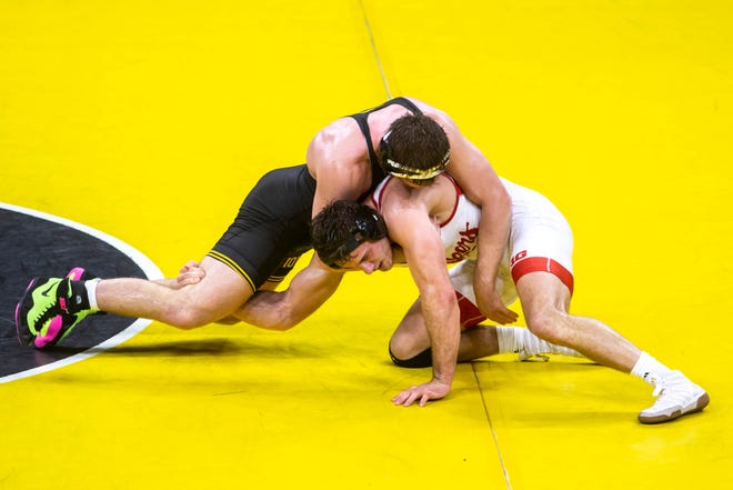 Iowa's Jacob Warner, left, wrestles Nebraska's Eric Schultz at 197 pounds during a NCAA Big Ten Conference wrestling dual, Friday, Jan. 15, 2021, at Carver-Hawkeye Arena in Iowa City, Iowa.