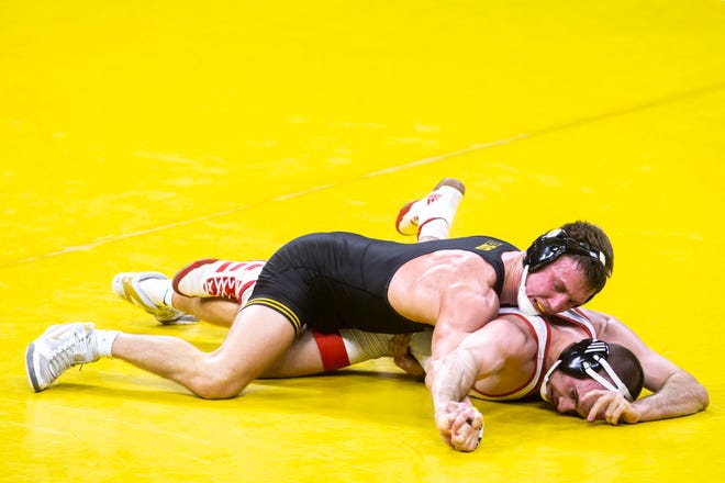 Iowa's Max Murin, top, wrestles Nebraska's Brock Hardy at 149 pounds during a NCAA Big Ten Conference wrestling dual, Friday, Jan. 15, 2021, at Carver-Hawkeye Arena in Iowa City, Iowa.