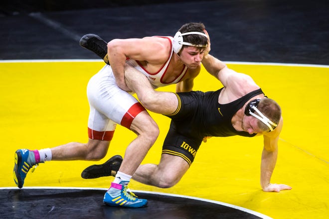 Nebraska's Mikey Labriola, left, wrestles Iowa's Patrick Kennedy at 174 pounds during a NCAA Big Ten Conference wrestling dual, Friday, Jan. 15, 2021, at Carver-Hawkeye Arena in Iowa City, Iowa.