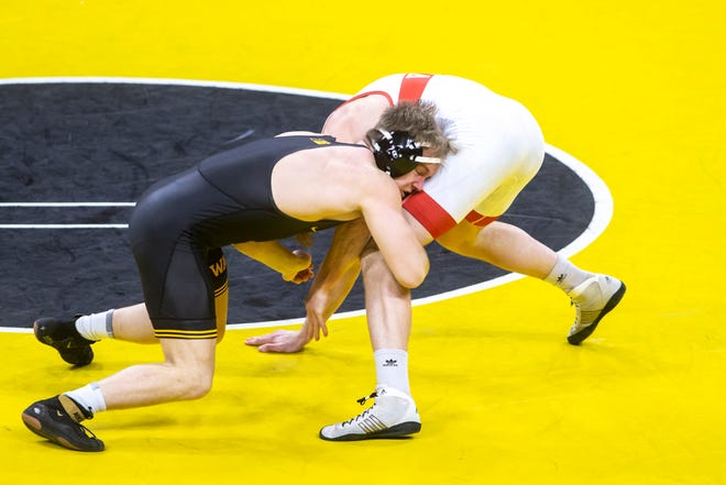 Iowa's Nelson Brands, left, wrestles Nebraska's Taylor Venz at 184 pounds during a NCAA Big Ten Conference wrestling dual, Friday, Jan. 15, 2021, at Carver-Hawkeye Arena in Iowa City, Iowa.