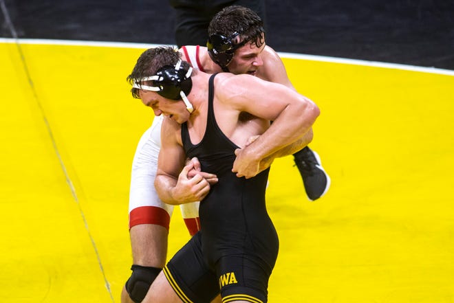 Nebraska's Eric Schultz, right, wrestles Iowa's Jacob Warner at 197 pounds during a NCAA Big Ten Conference wrestling dual, Friday, Jan. 15, 2021, at Carver-Hawkeye Arena in Iowa City, Iowa.