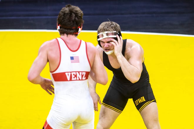 Iowa's Nelson Brands, right, wrestles Nebraska's Taylor Venz at 184 pounds during a NCAA Big Ten Conference wrestling dual, Friday, Jan. 15, 2021, at Carver-Hawkeye Arena in Iowa City, Iowa.