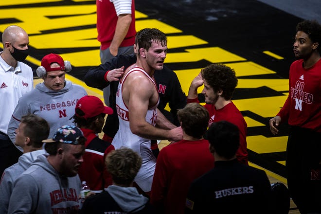 Nebraska's Eric Schultz celebrates with teammates after a match at 197 pounds during a NCAA Big Ten Conference wrestling dual, Friday, Jan. 15, 2021, at Carver-Hawkeye Arena in Iowa City, Iowa.