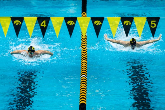 Iowa's Evan Holt, left, and Alex Gonzalez compete in the 200 yard butterfly during a NCAA Big Ten Conference swimming and diving meet, Saturday, Jan. 16, 2021, at the Campus Recreation and Wellness Center on the University of Iowa campus in Iowa City, Iowa.