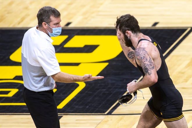 Iowa head coach Tom Brands gives Jaydin Eierman a high-five after his match 141 pounds during a NCAA Big Ten Conference wrestling dual, Friday, Jan. 15, 2021, at Carver-Hawkeye Arena in Iowa City, Iowa.