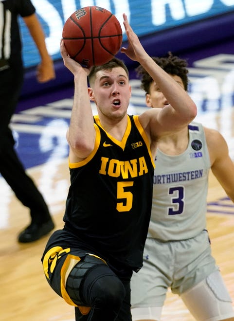 Iowa guard CJ Fredrick goes up for a shot against Northwestern during the first half of an NCAA college basketball game in Evanston, Ill., Sunday, Jan. 17, 2021. (AP Photo/Nam Y. Huh)